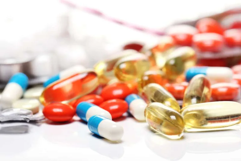 A heap of capsules, softgels and tablets.